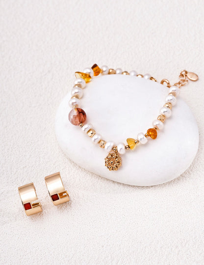 Solène freshwater pearl bracelet styled with gold earrings