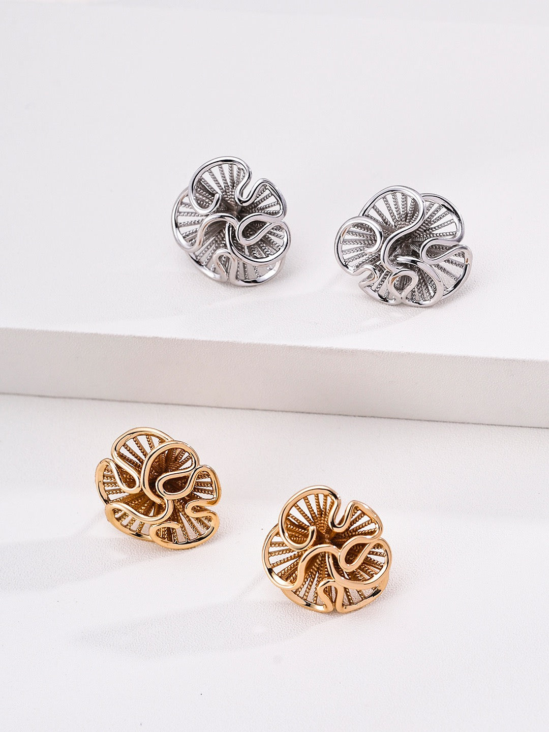 Fleuron sculptural earrings styled view