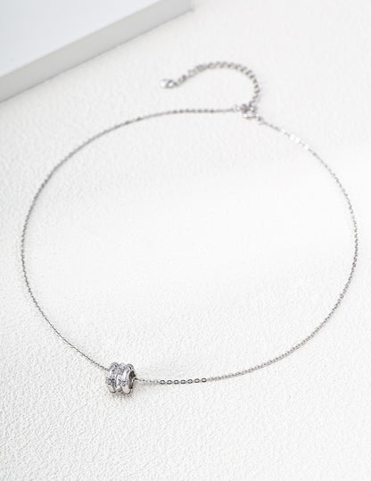 Gold and silver Astra wheel pendant necklaces with cubic zirconia