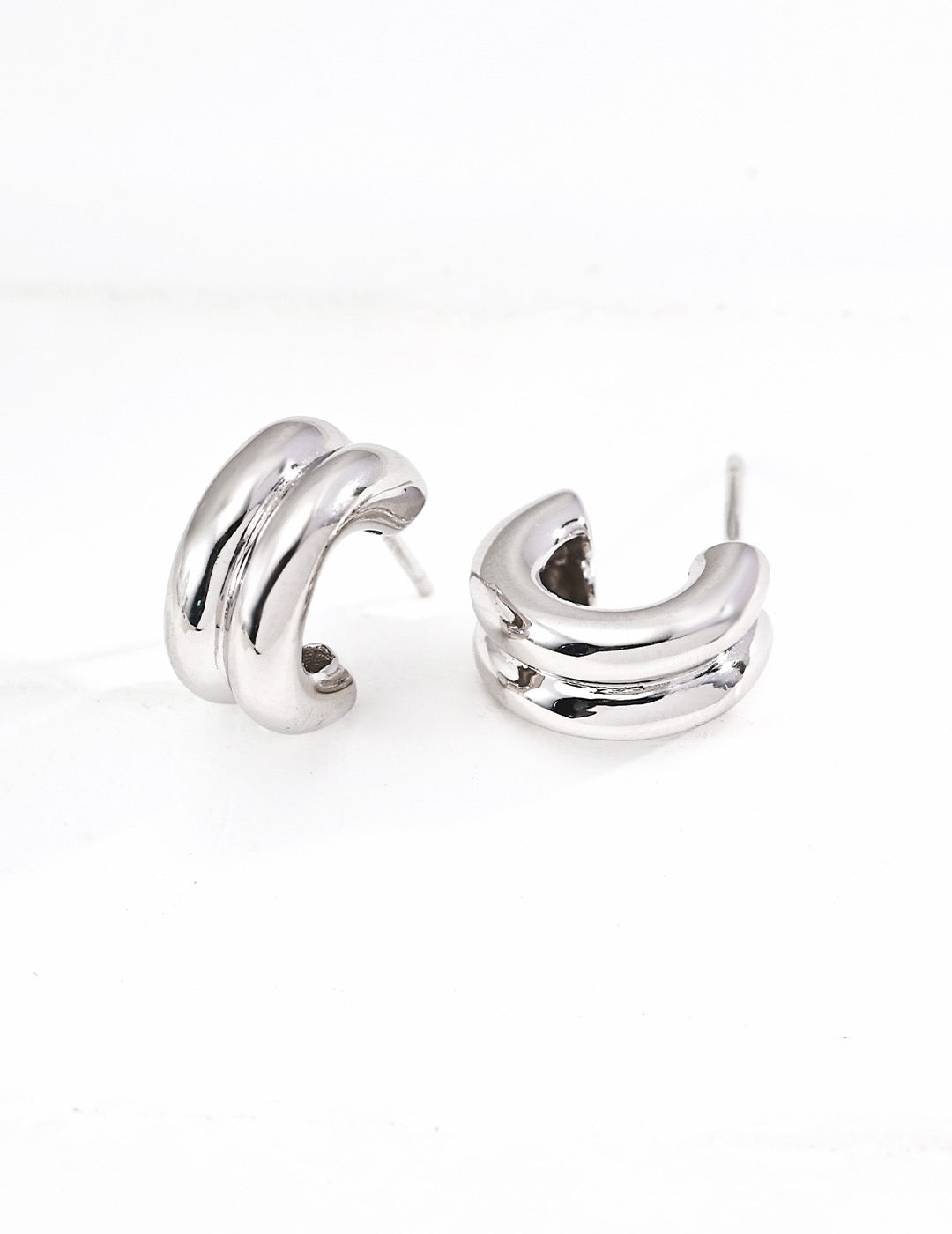 Trinité two-tone gold and silver huggie earrings