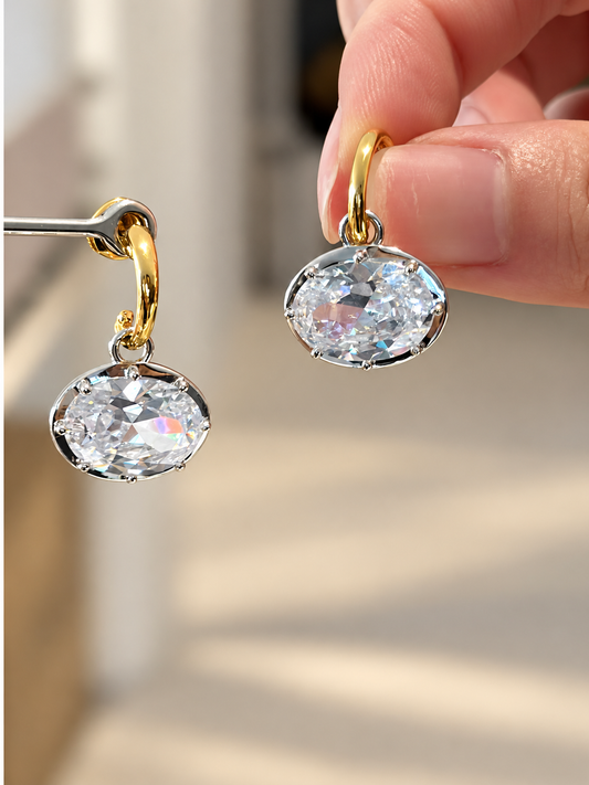 Oval 5A cubic zirconia drop earrings in gold-plated sterling silver, detail view