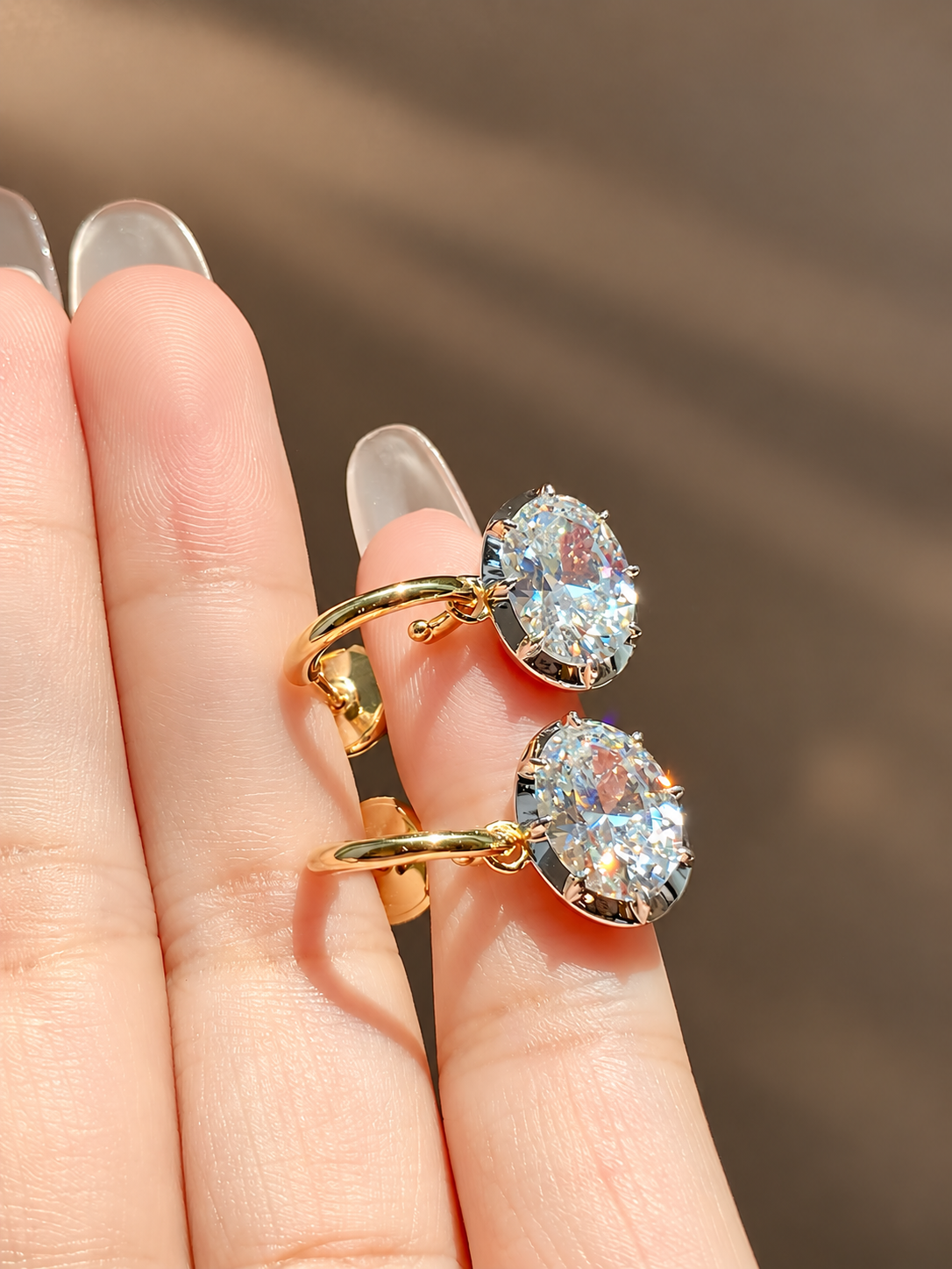 Oval 5A cubic zirconia drop earrings in gold-plated sterling silver, detail view