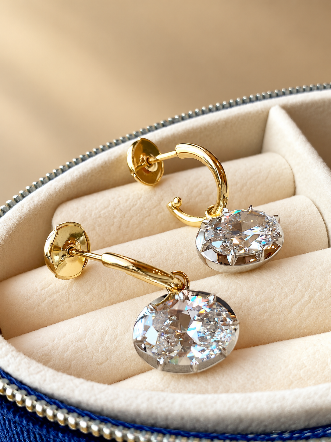 Oval 5A cubic zirconia drop earrings in gold-plated sterling silver, detail view